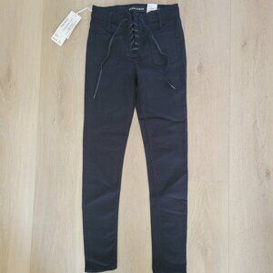 Black skinny crop jeans with lace tie up fly